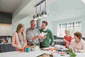 Man reading a birthday card with his family